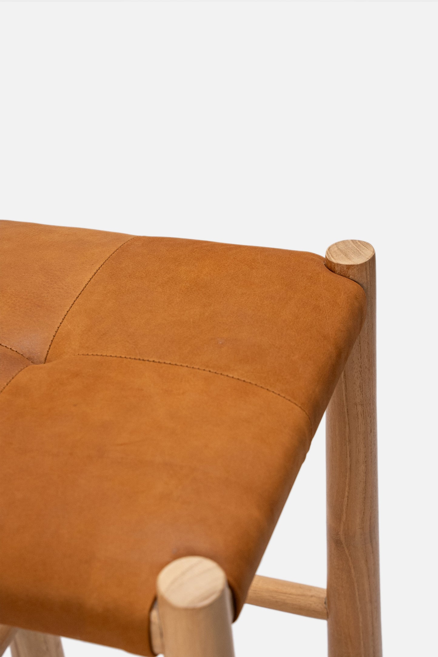 Avni Upholstered Leather Backless Teak Counter Stool