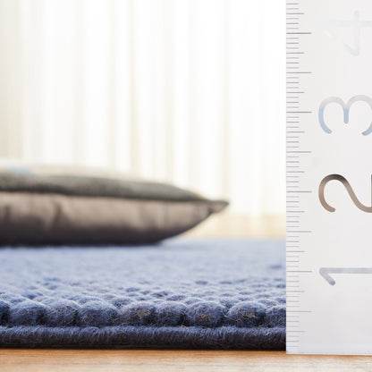 SAFAVIEH Handmade Natura Gonnie Wool Rug